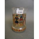 A C19th Dutch enamelled glass beaker with decoration of a young man and woman, flanked by turtle