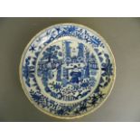 A Chinese blue and white porcelain charger with painted decoration of an emperor and his court,