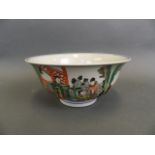 A Chinese famille verte enamel porcelain bowl decorated with figures in a temple, 6 character mark