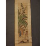 A Chinese watercolour scroll depicting four figures beneath a rocky outcrop, 12½" x 48½"