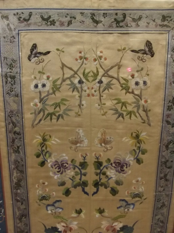 A late C19th Chinese silk embroidery of butterflies amongst flowers, 16" x 28" - Image 2 of 3