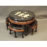 A mid C20th Chinese tea table and matching four stools, with carved decoration, the top with painted