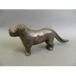 A C19th Eastern bronze nutcracker in the form of a dog, 12" long