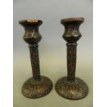 A pair of C19th Chinese cinnabar lacquer candlesticks with floral decoration, 6" high