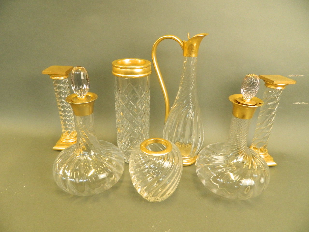 A collection of seven pieces of Continental glass items with gilt collars and fittings, comprising