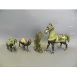 An Eastern bronze figure of a horse with green patina, together with similar camel, elephant and