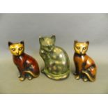 A pair of lacquered bronze figures of cats, together with a larger patinated metal cat, largest 7½"