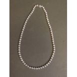 A silver and cubic zirconia set choker necklace, 16½" long