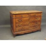 A C19th French commode of two over three drawers with decorative quartered veneer fronts, raised