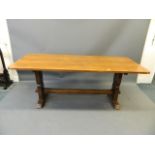 An oak refectory table with end supports and pegged stretchers, 31" x 29" x 72"