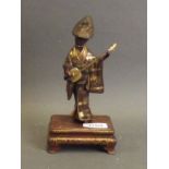 A fine Japanese Meiji period Miyao bronze figure of a woman playing a shamisen, with gilt