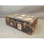 A vintage steamer trunk with Cunard White Star Line label, 21" x 36" x 12"