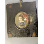 An early C19th naïve miniature portrait of a young girl, 2½" diameter