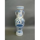 A large Chinese Ming style blue and white porcelain vase with twin elephant mask handles and painted