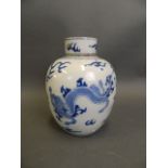 A Chinese blue and white porcelain jar and cover with stylised twin dragon decoration, 6½" high