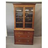 A Victorian oak display cabinet with beaded moulding decoration, two door glazed upper section and