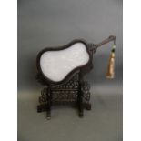 A Chinese white jade and carved hardwood table screen in the form of a fan with carved dragon and