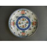 A Chinese polychrome enamel porcelain saucer dish decorated with water fowl and lotus flowers, 6