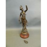 A spelter sculpture of a female musician, after Ferrand, mounted on a marbleised wood plinth, 17"