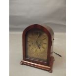 A C19th French mahogany cased mantle clock, the dial with chased and engraved floral scroll