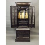 A Chinese hardwood Butsudan shrine cabinet with sectional interior enclosed by two grilled doors