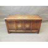 A four panel oak coffer with carved Tudor rose decoration, mid C20th, 44" x 19" x 22"