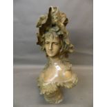 A patinated bronze bust of a young woman in a hat, signed 'Ant. Ohlson...', 28" high