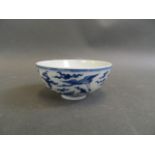 A Chinese blue and white porcelain tea bowl decorated with storks in flight, seal mark to base,