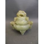 A Chinese carved jadeite koro and cover, the squat base with carved Fo dog handles and loose