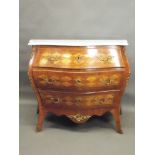 A late C19th/early C20th Swedish bombé shaped three drawer commode with harlequin marquetry