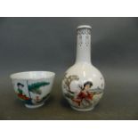 A small Chinese porcelain bottle vase decorated with a girl seated in a garden and calligraphy,