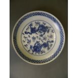 A Chinese blue and white porcelain dish decorated with two dragons chasing the flaming pearl, 6