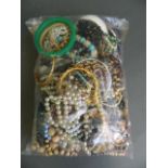 A collection of assorted costume jewellery to include bracelets, earrings, necklaces etc