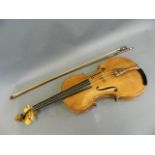 A violin with two piece back, together with a bow and case, labelled, 24" long