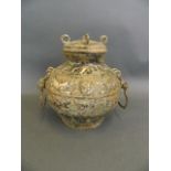 A Chinese Song style mixed metal pot and cover with twin handles and chased tiger decoration, 8"