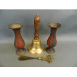 A brass bell with turned wood handle, together with a pair of enamelled brass vases, and a brass