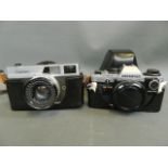 A Canon Canonet 35mm camera, and a Canon OM 10 camera body