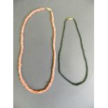 A three strand coral necklace, together with a graduated emerald shard necklace, longest 22"