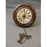A C19th postman's wall clock with enamelled dial, striking on a bell, 11" long, dial 7"