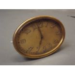 An early C19th gilt and brass easel clock with luminous Arabic numerals and Swiss movement, 4" wide