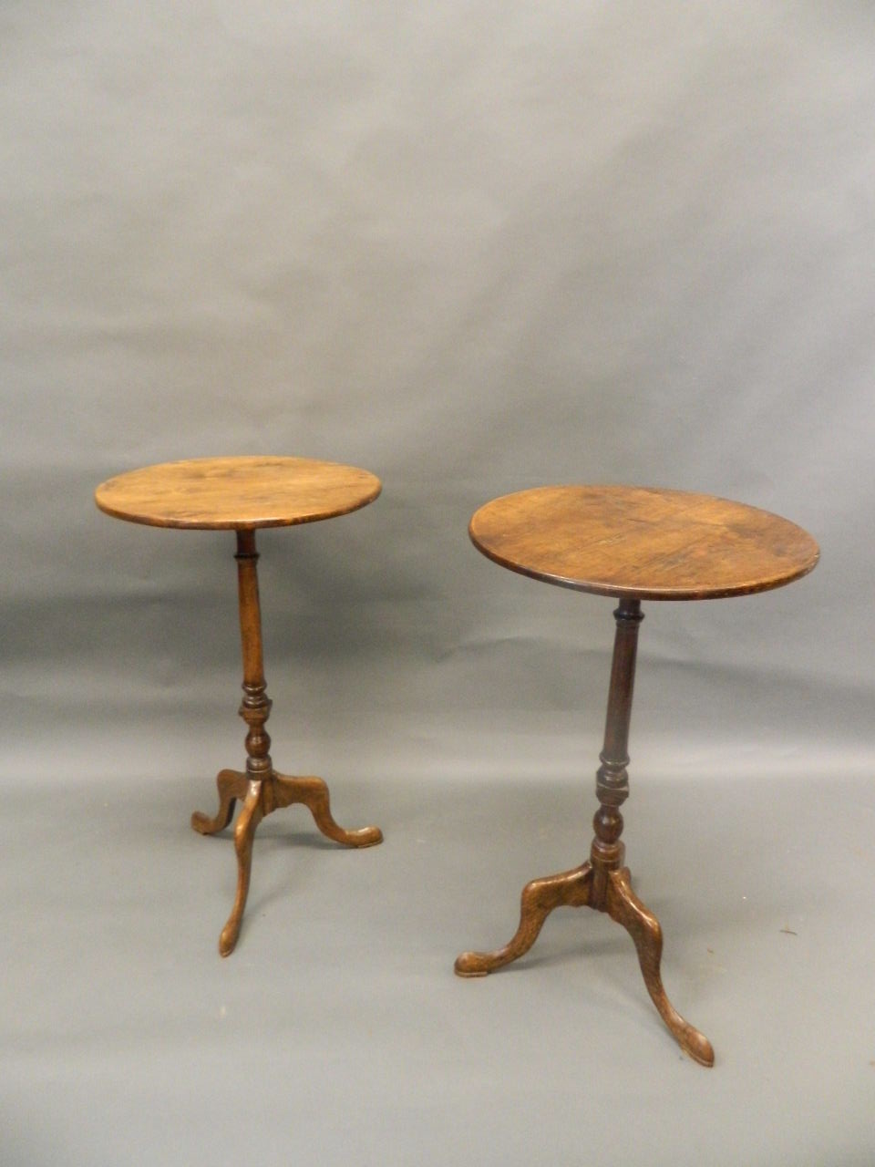 A pair of antique elm occasional tables, raised on turned columns and tripod supports with pad feet, - Image 2 of 3