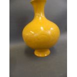 A Chinese yellow ground bulbous vase with self patterned decoration of dragons, 6 character mark