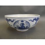 A Chinese blue and white porcelain bowl with decorative panels depicting scholars, 4 character