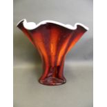 A large red and white studio glass vase of organic form, 14" high