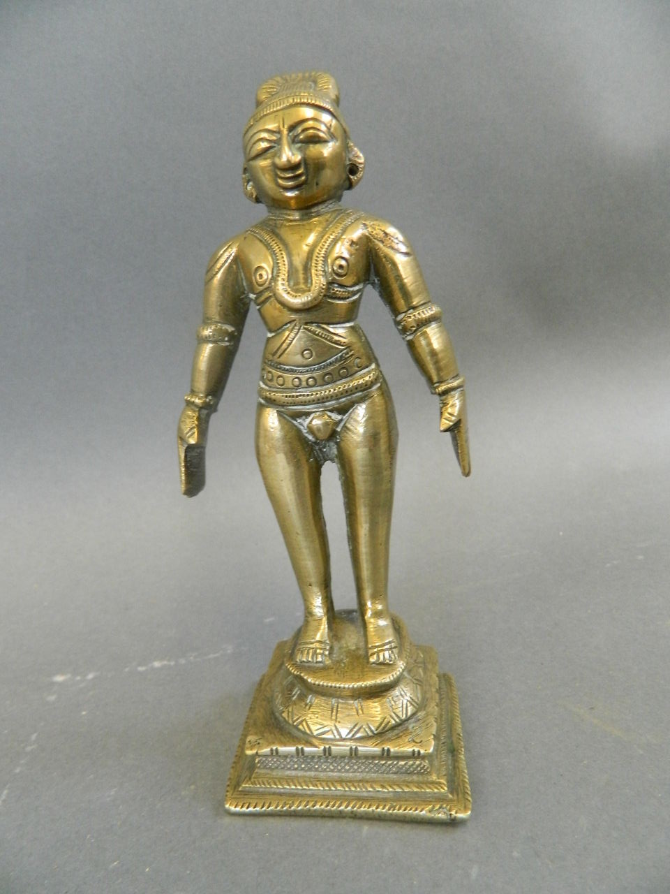 An Indian bronze figure of a deity, 5" high