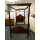An Edwardian figured mahogany four poster single bed with moulded and carved decoration, 45" x 72" x