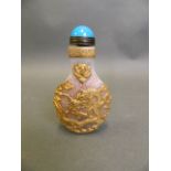 A Chinese glass snuff bottle with applied carved and gilt dragon decoration, 2 character mark to