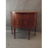 A C19th figured mahogany demi-lune side cabinet with Adam style penwork inlaid decoration of