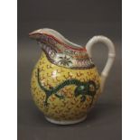 A Chinese porcelain jug with yellow glaze and dragon decoration, late C19th/early C20th, 5" high