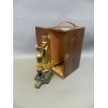 A C19th 'Eclipse' microscope no. 6184, of brass construction, on a cast iron base, in original